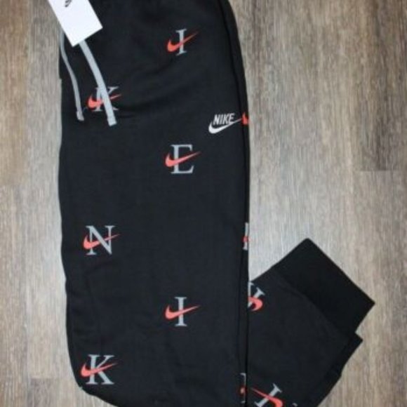 NWT NIKE MEN'S ALL OVER PRINT LOGO JOGGER‎ SWEATPANTS BLACK ORANGE WHITE - Picture 1 of 9
